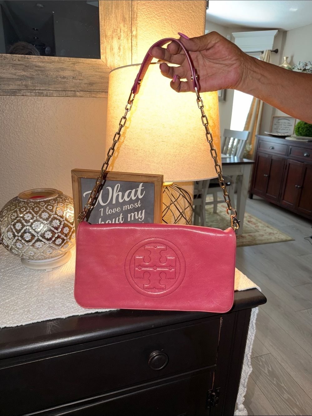 Tory Burch Bombe Reva Clutch in red leather with a gold chain strap.
